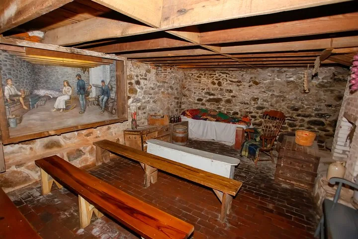 Cellar interior at Jennie Wade House with benches and display